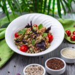 quinoa salad tomato cucumber basil parsley side view